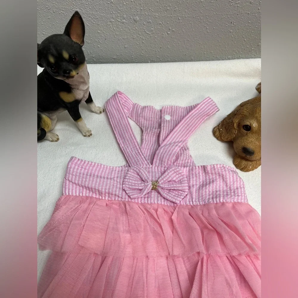 Pink and white striped ruffled dog dress with suspenders
